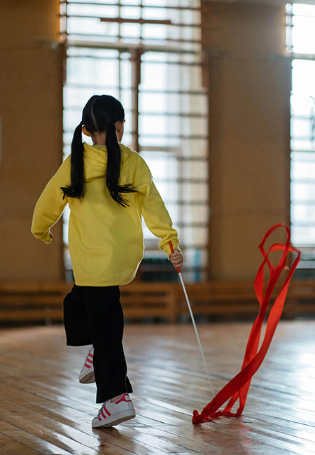 Young girl twirling ribbon
